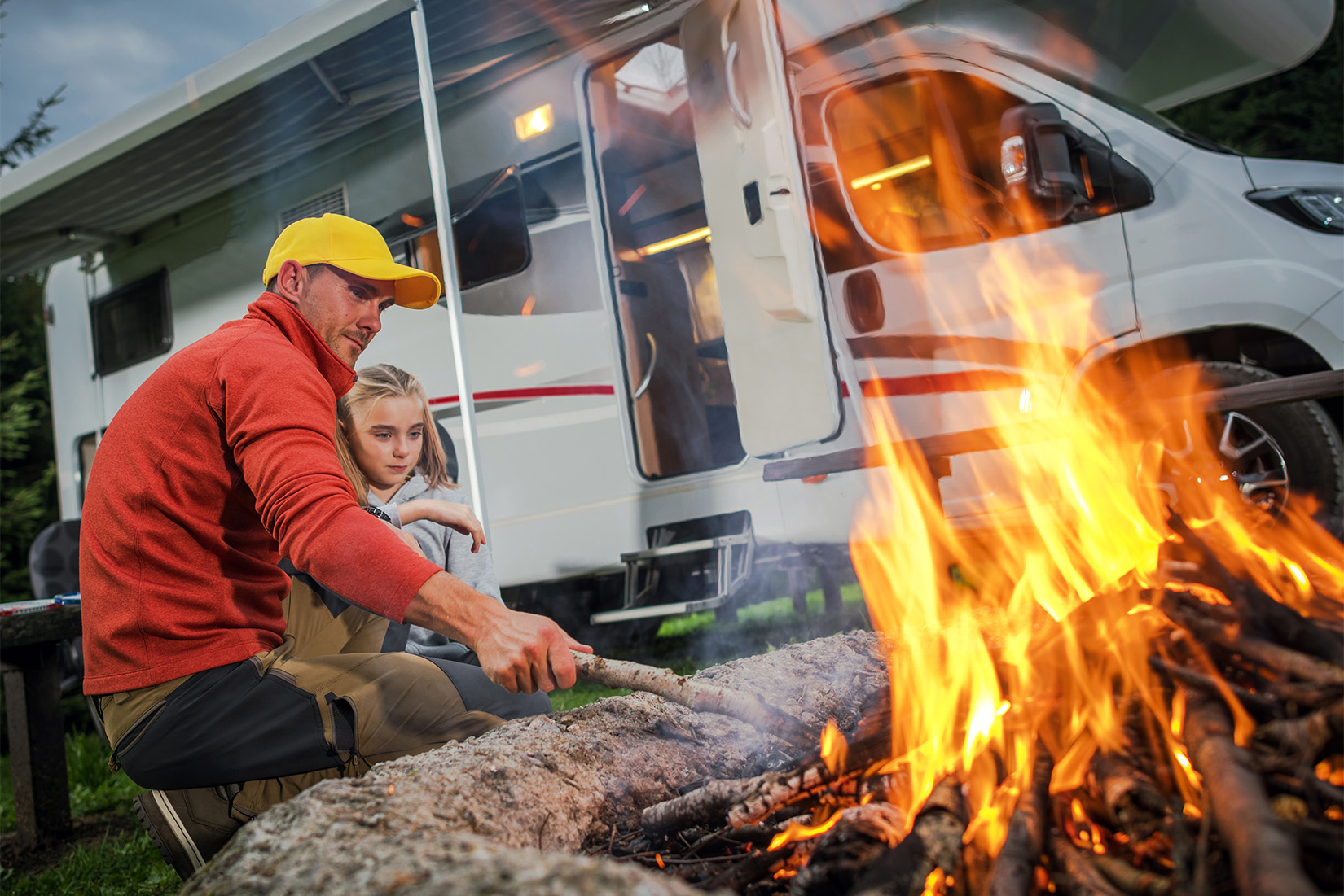 WhatYourRVSaysAboutYou-father-daughter-5 | I Heart RVing father and daughter at campfire near RV