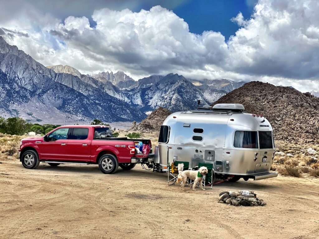 john-schnick-QXSUg-9Cgik-unsplash | I Heart RVing Dog enjoying the campsite