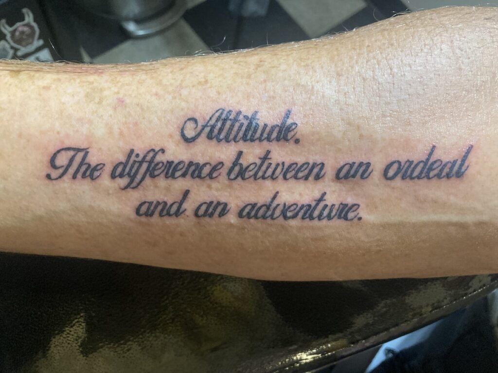 Order – October 9, 2025 @ 11:00 PM | I Heart RVing Gary Hassett's motto tattooed: Attitude: The difference between an ordeal and an adventure.