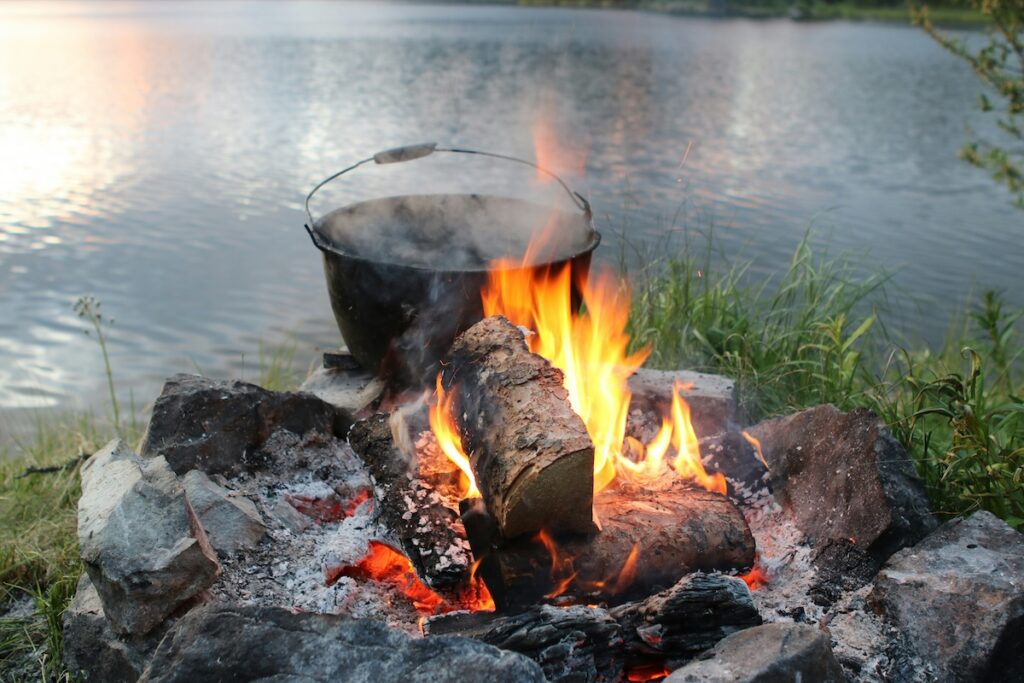cooking with a dutch oven over a fire