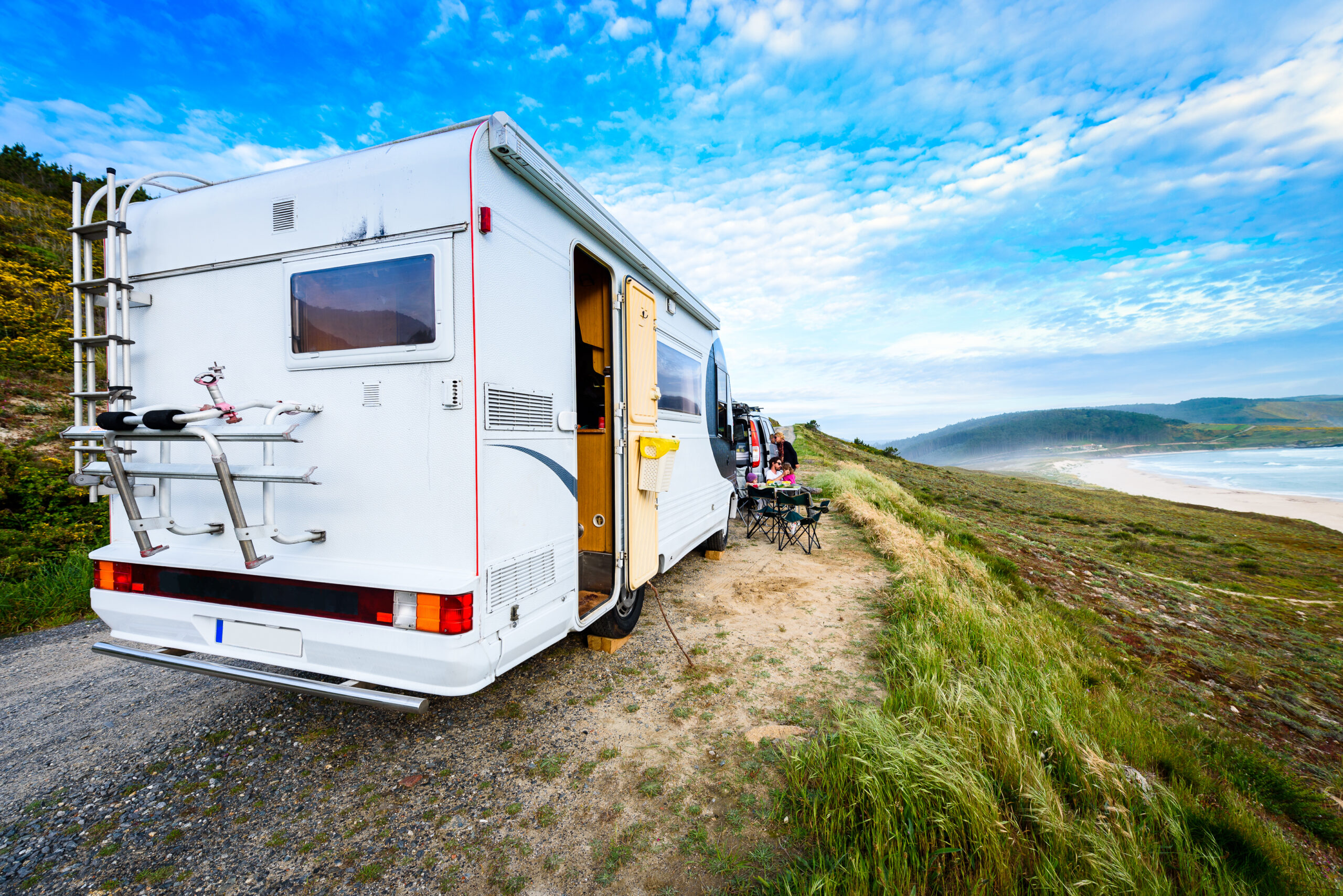 Motorhome RV and campervan are parked on a beach | I Heart RVing