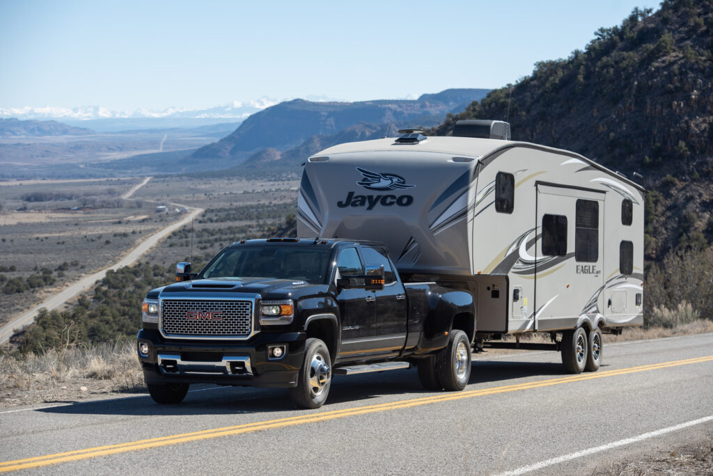 A truck pulling a travel trailer.