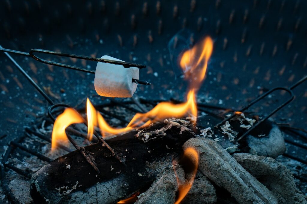 Roasting a marshmallow over an open flame